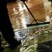 A friend of the store helps remove water from Renaissance in Ann Arbor on Tuesday. Daniel Brenner I AnnArbor.com